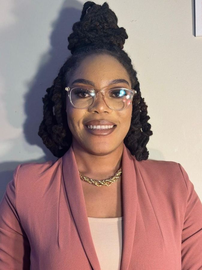 Jhenyse, loctician and owner of J&K Dreadlock Studio