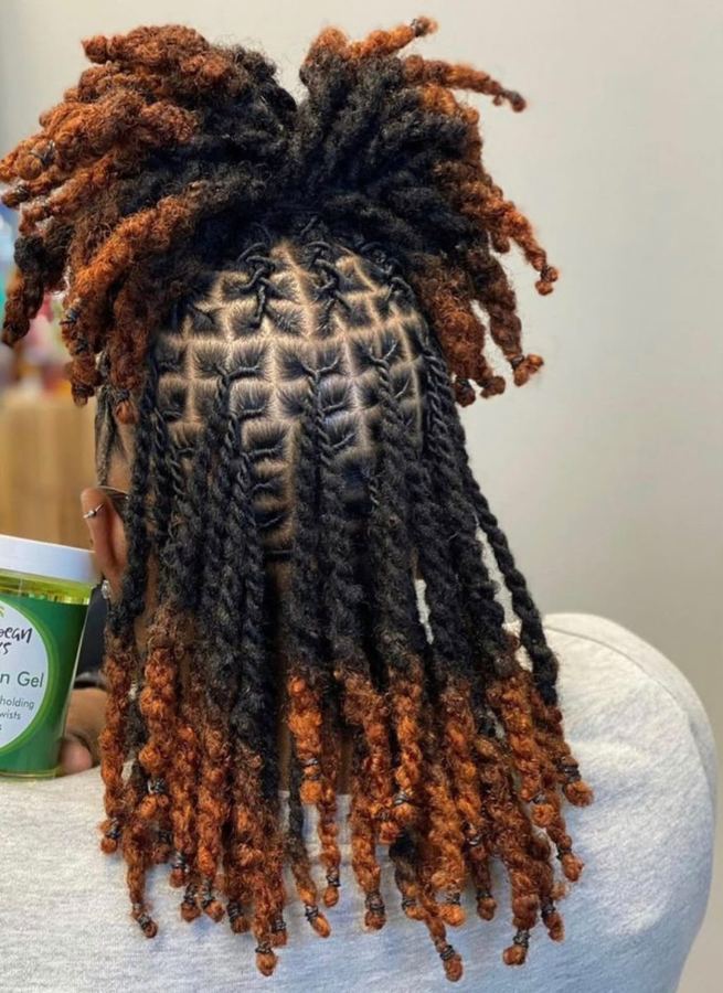 Waist-length locs with a copper barrel-twist crown